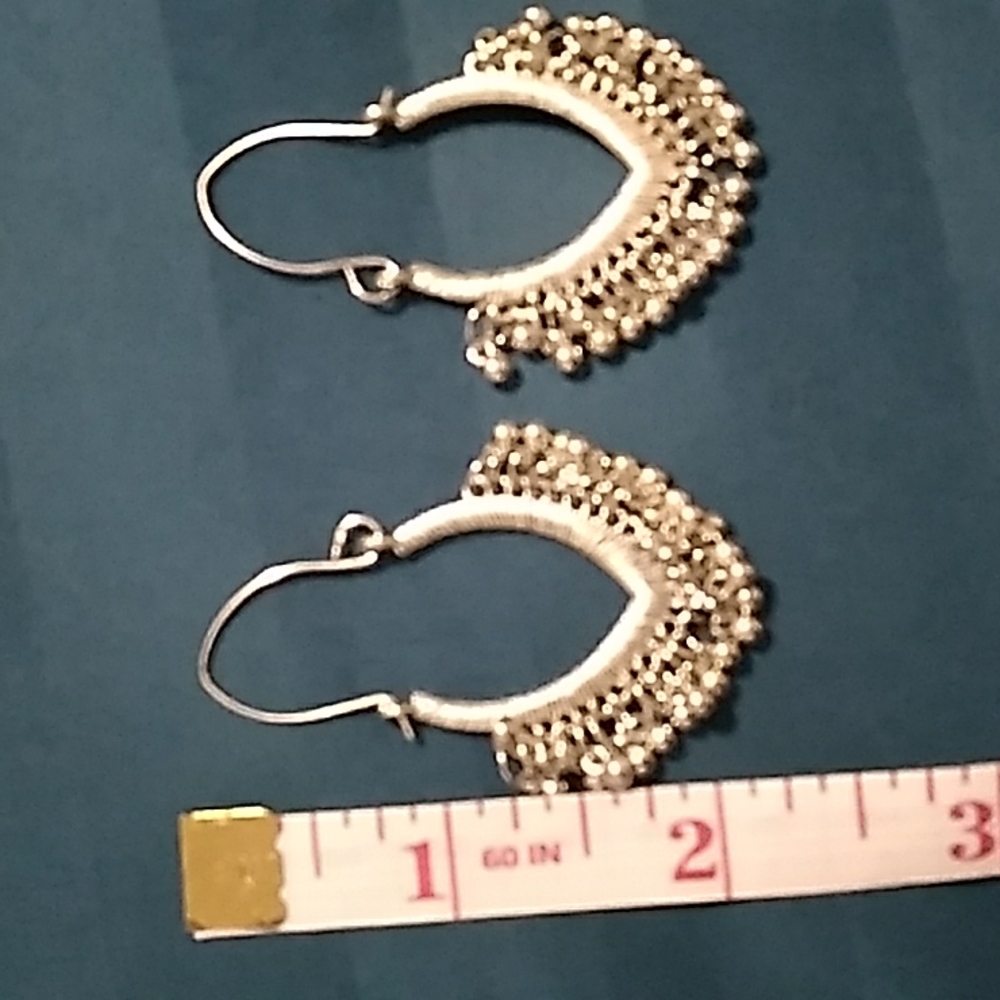 Silver metal earrings open with individual balls